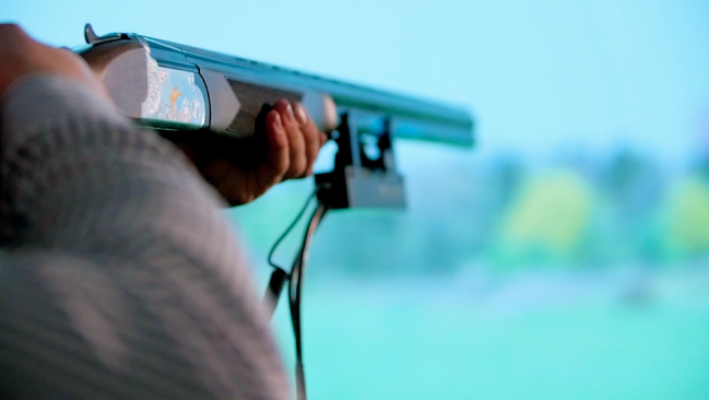 Man using sim Image of person using the shooting simulator